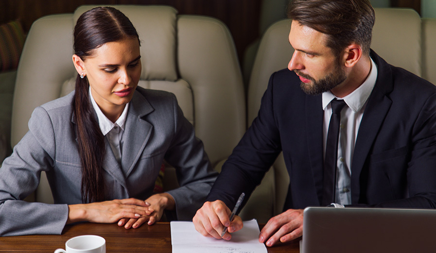 business-team-on-private-jet-2CGA3WY